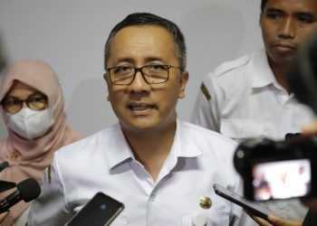 Kepala Dinas Kependudukan dan Pencatatan Sipil (Dispendukcapil) Kota Surabaya, Agus Imam Sonhaji.